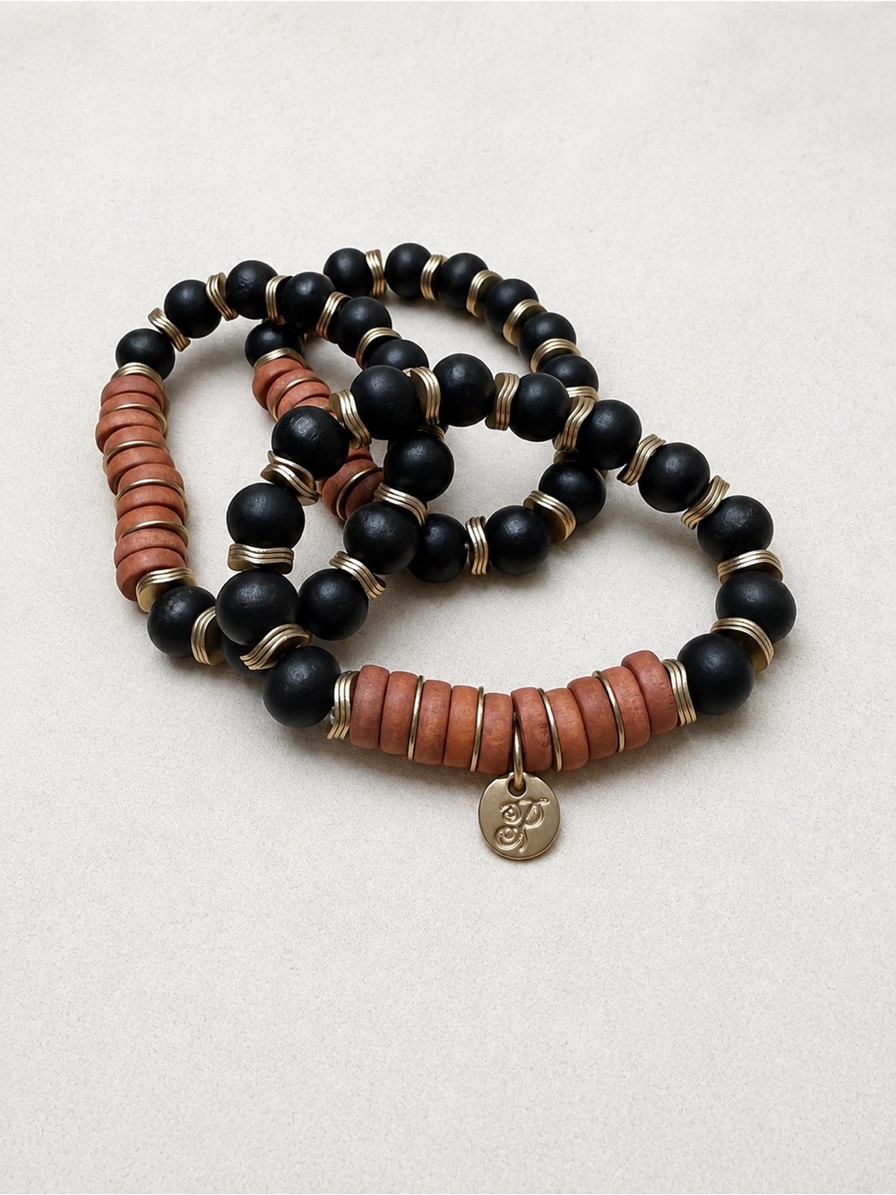 Plunder Stacked Black, Rust, and Gold Beaded Stretch Bracelet Set